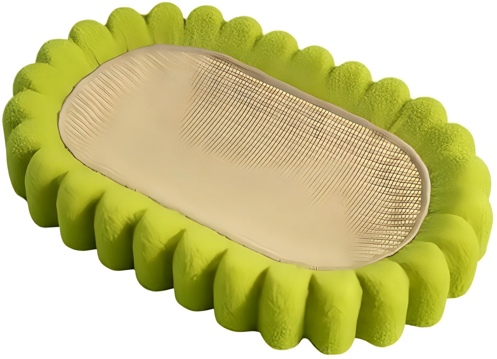 Green oval cardboard cat scratching pad with sisal surface, serving as a cat bed.