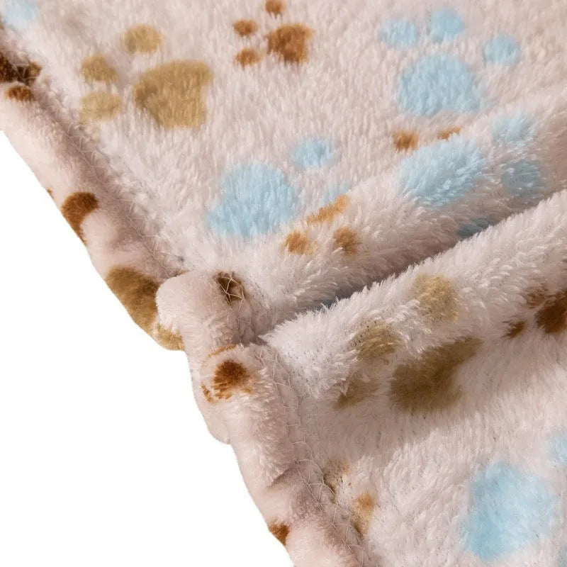 Blue cartoon dog pattern double-sided flannel pet blanket shown in a dog crate.