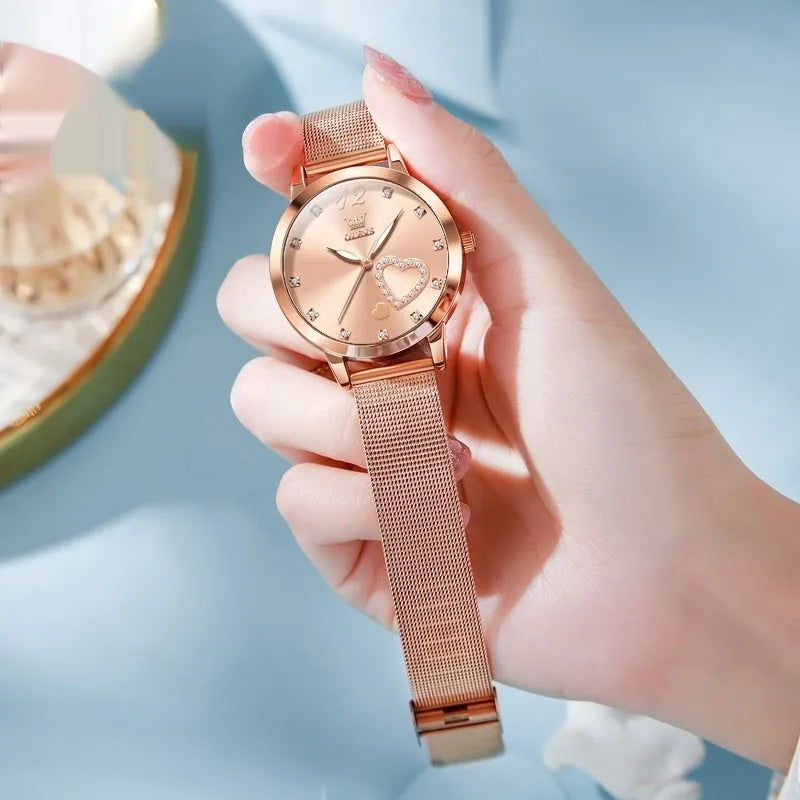Women's rose gold fashion watch with mesh strap showing choice of six dial colours: white, black, blue, red, pink, green.