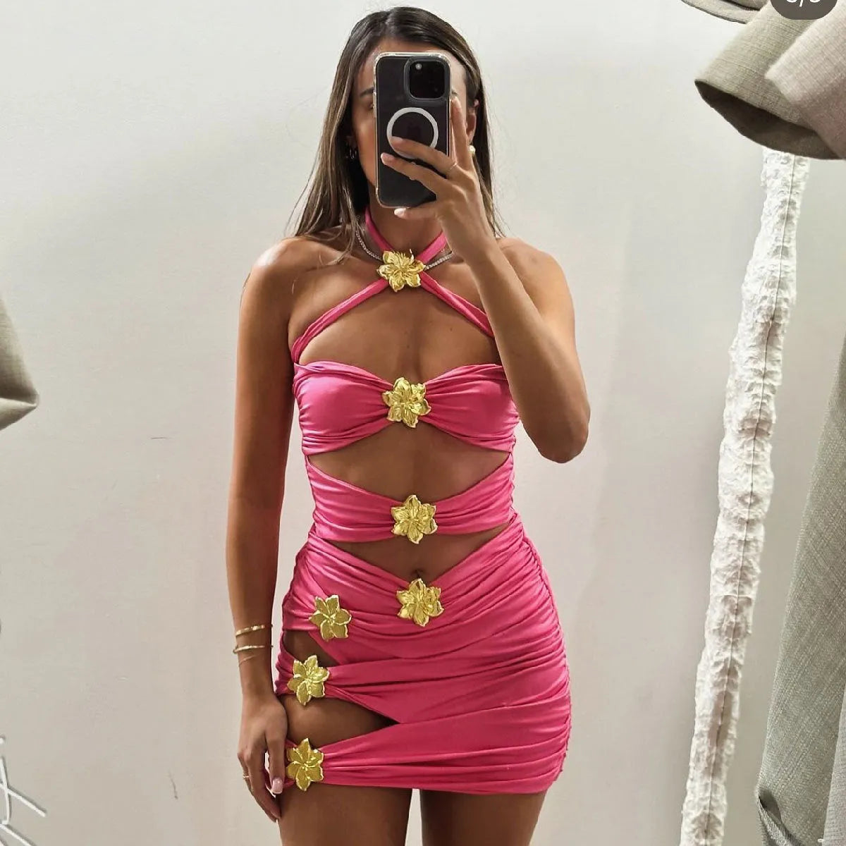 Adult female one-piece swimsuit with hollow-out tube top and matching short skirt in solid colour