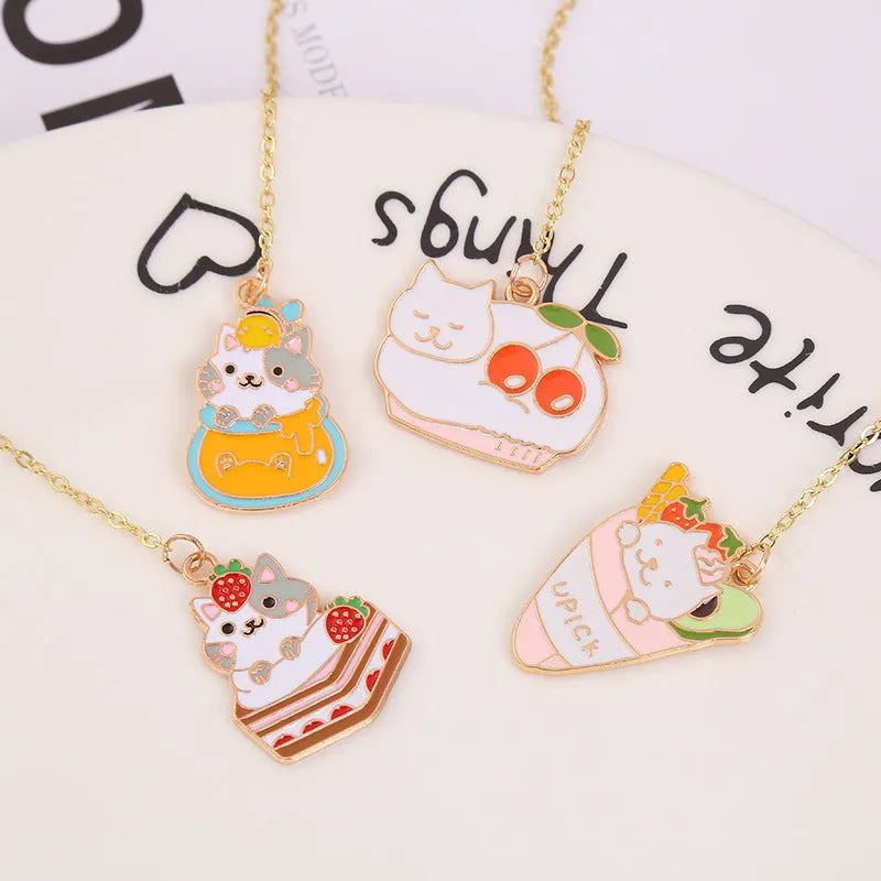 Metal bookmark with cartoon cat pendant in one of four designs measuring 3.8cm by 18.3cm