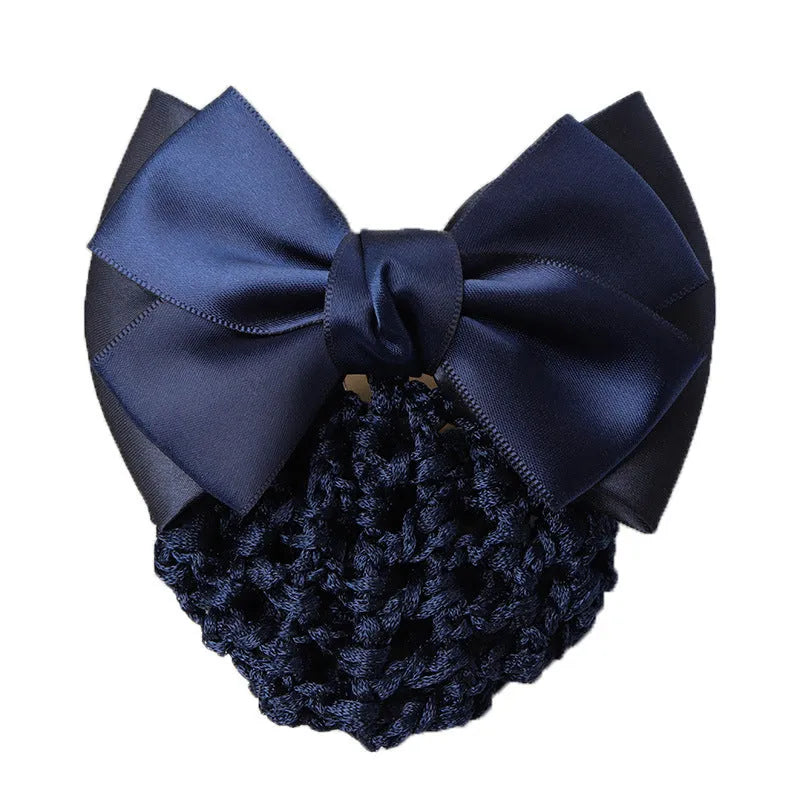 Professional hair clip with a black net pocket and a red flower bow ornament on a white background.