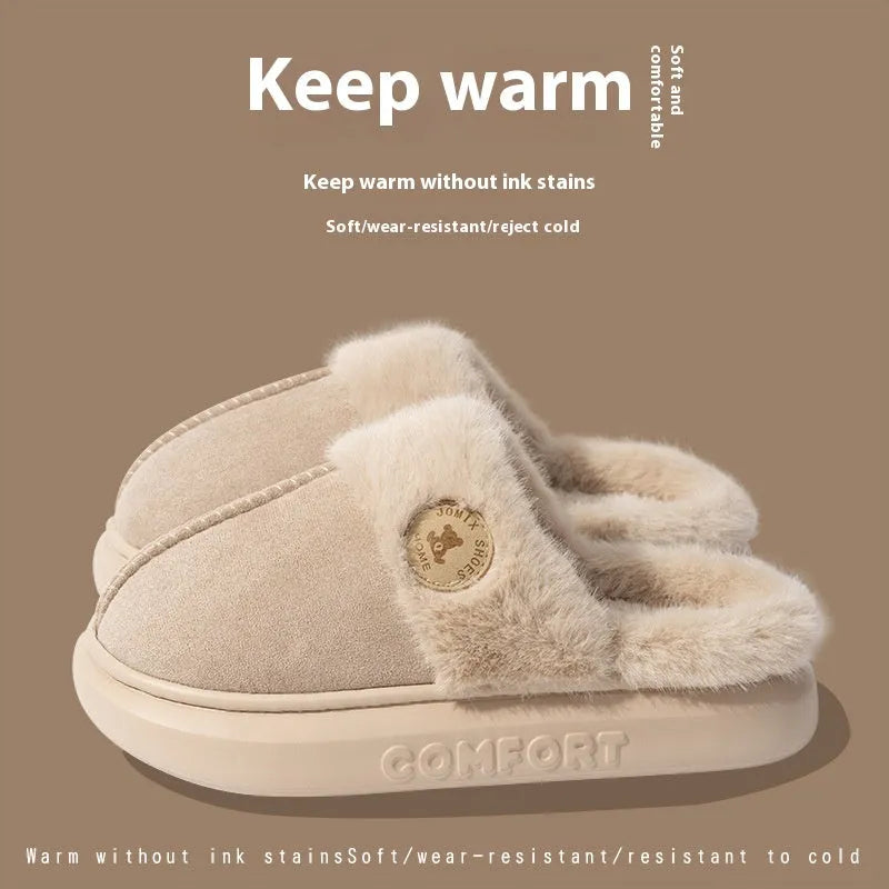 A pair of thick-soled plush fleece slippers in a chosen colour, showing decorative car stitching on the upper.