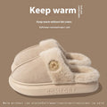A pair of thick-soled plush fleece slippers in a chosen colour, showing decorative car stitching on the upper.