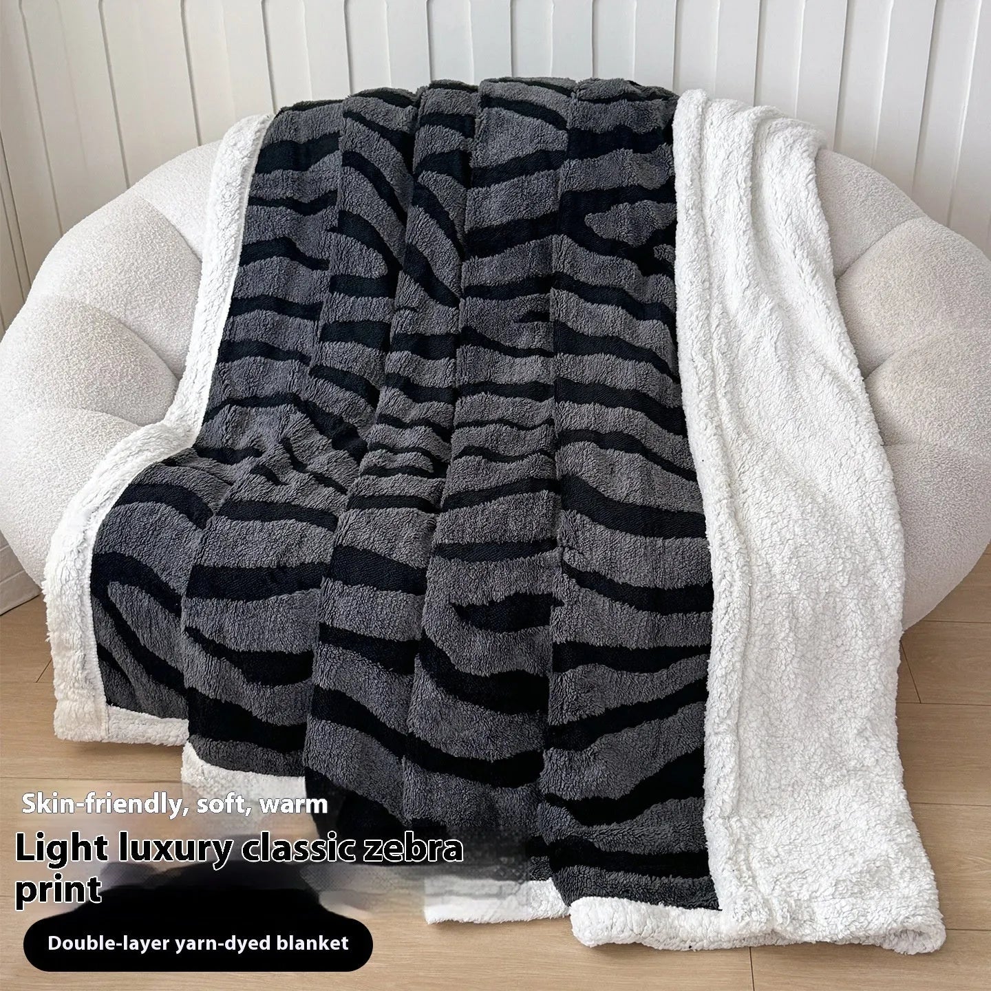 Double-layer leopard jacquard taffeta blanket in camel zebra pattern on a single bed.