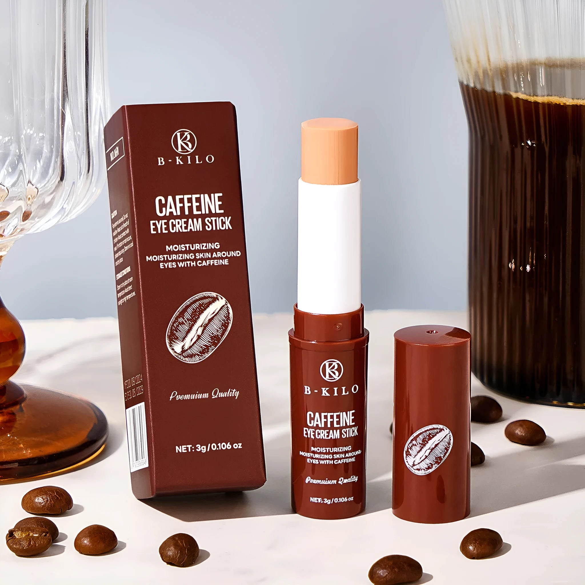 Caffeine eye cream stick in silver and white packaging, 3g net content.