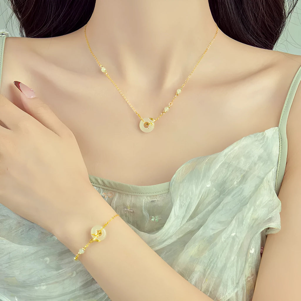 Women's antique-style silver bracelet with a peace symbol safety buckle clasp, shown in gold and silver finishes.