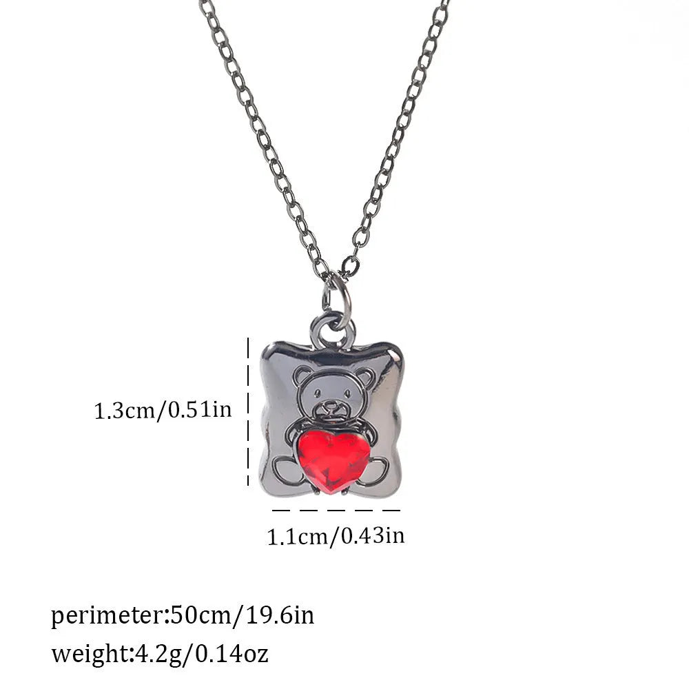 Gothic Halloween necklace with spider and bat alloy pendant on a chain.