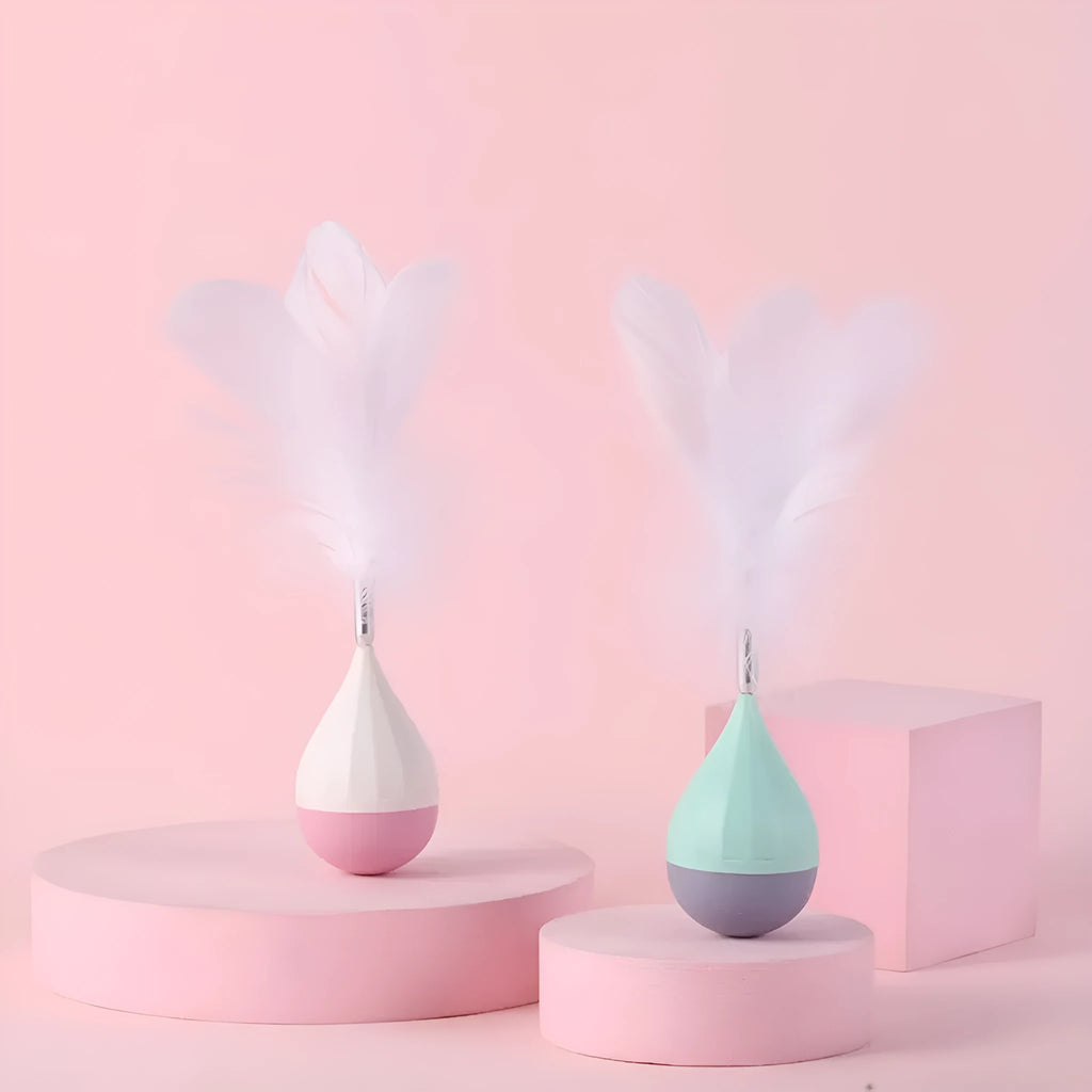 Green and pink feather tumbler cat toy with tease ball on stick
