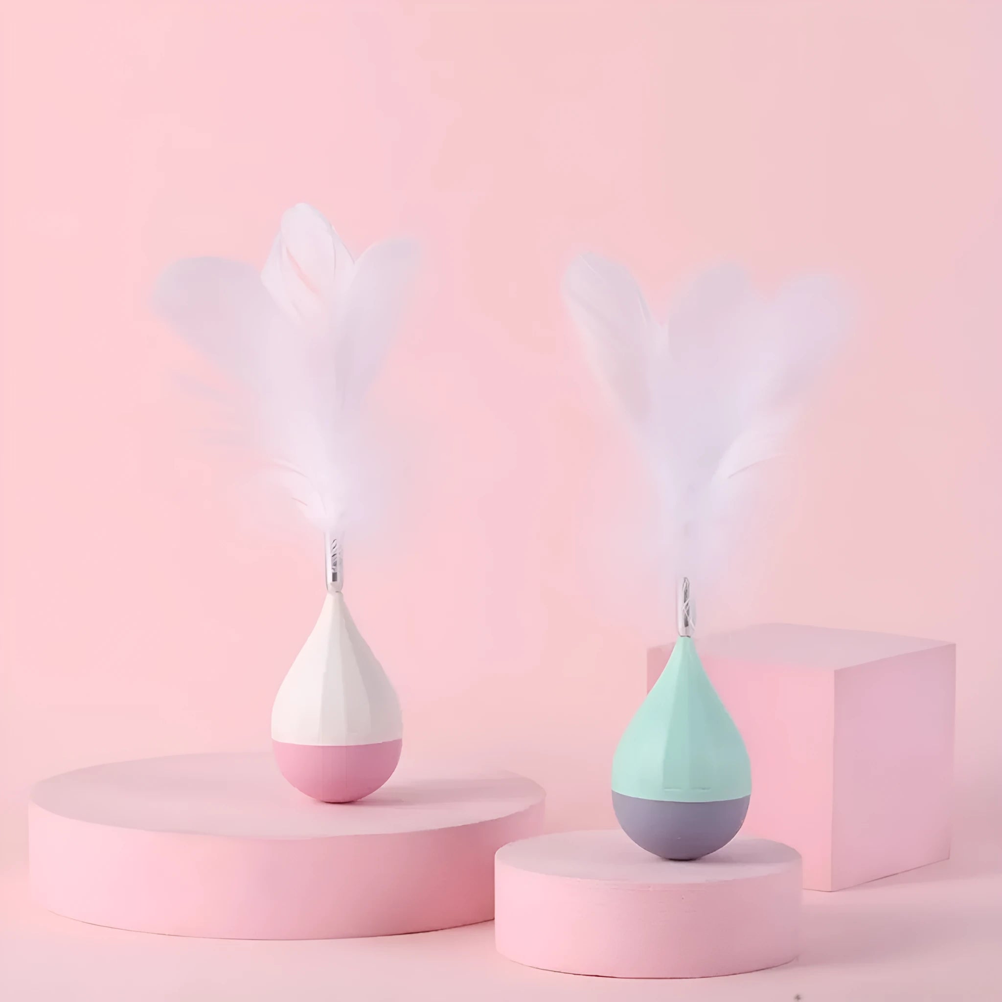 Green and pink feather tumbler cat toy with tease ball on stick