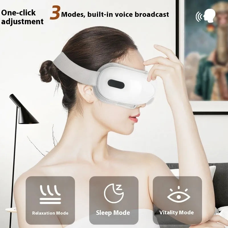 White portable electric eye massager with hot compress and airbag massage functions on a plain background