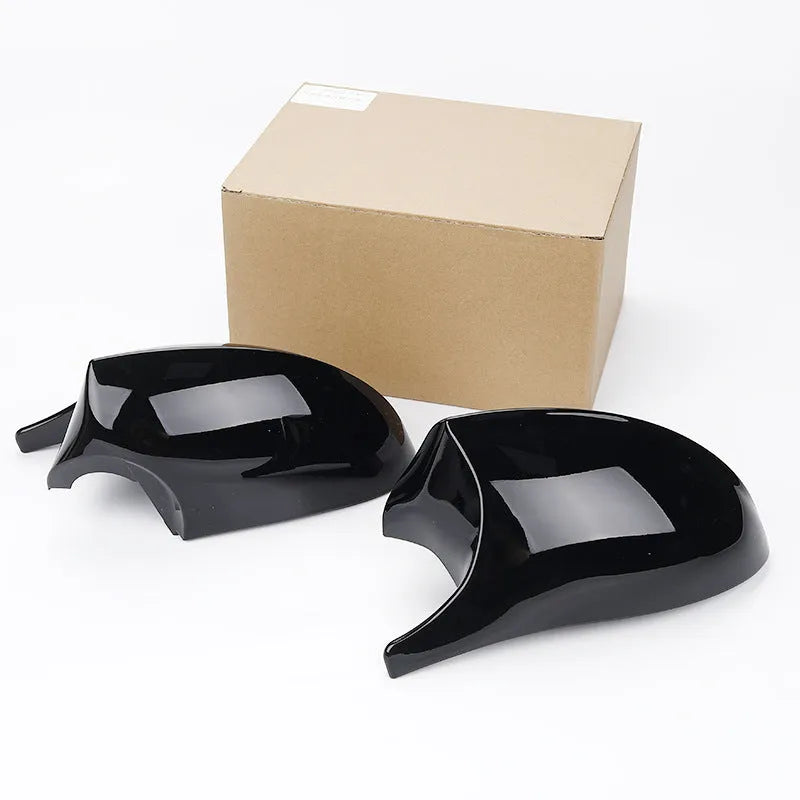 Pair of black ABS plastic rearview mirror housings for BMW 3 Series E90 model.