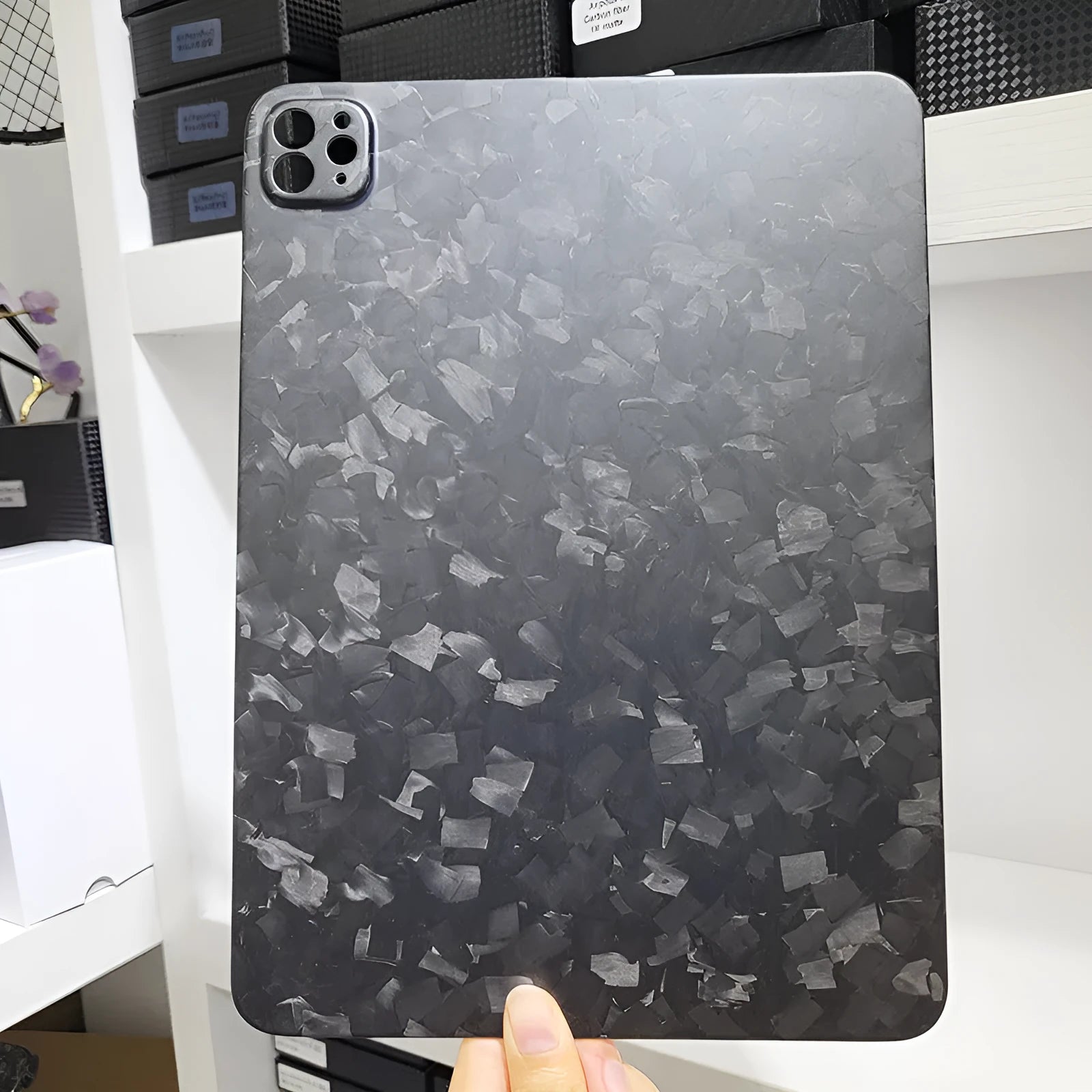Carbon fibre hard protective case for Apple iPad Pro 11 showing embossed plaid pattern and choice of surface finishes.