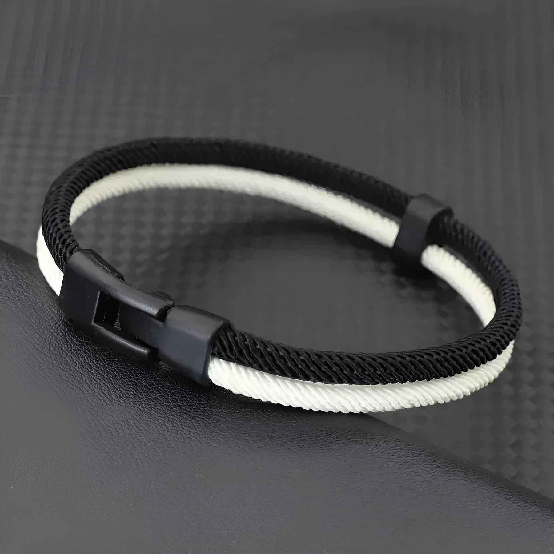 Black and white woven Milan rope alloy hand strap showing three size variations