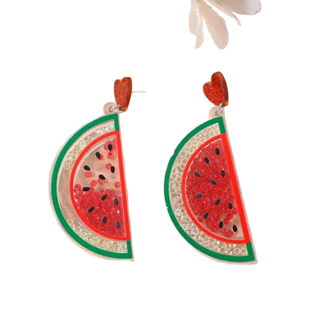 Colourful acrylic novelty earrings shaped like fruits and desserts including cherry, strawberry, and ice cream.