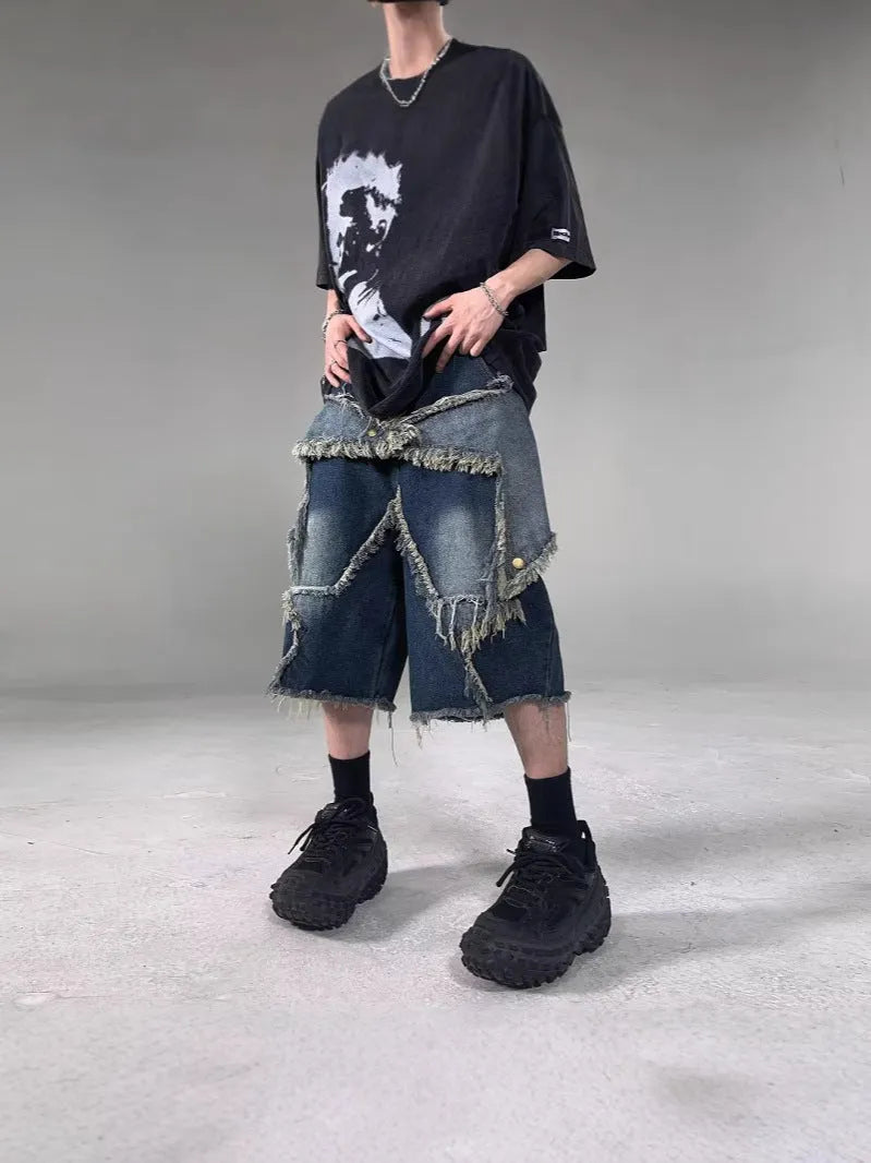 Blue denim shorts with frayed detailing and five-pointed star design in loose fit